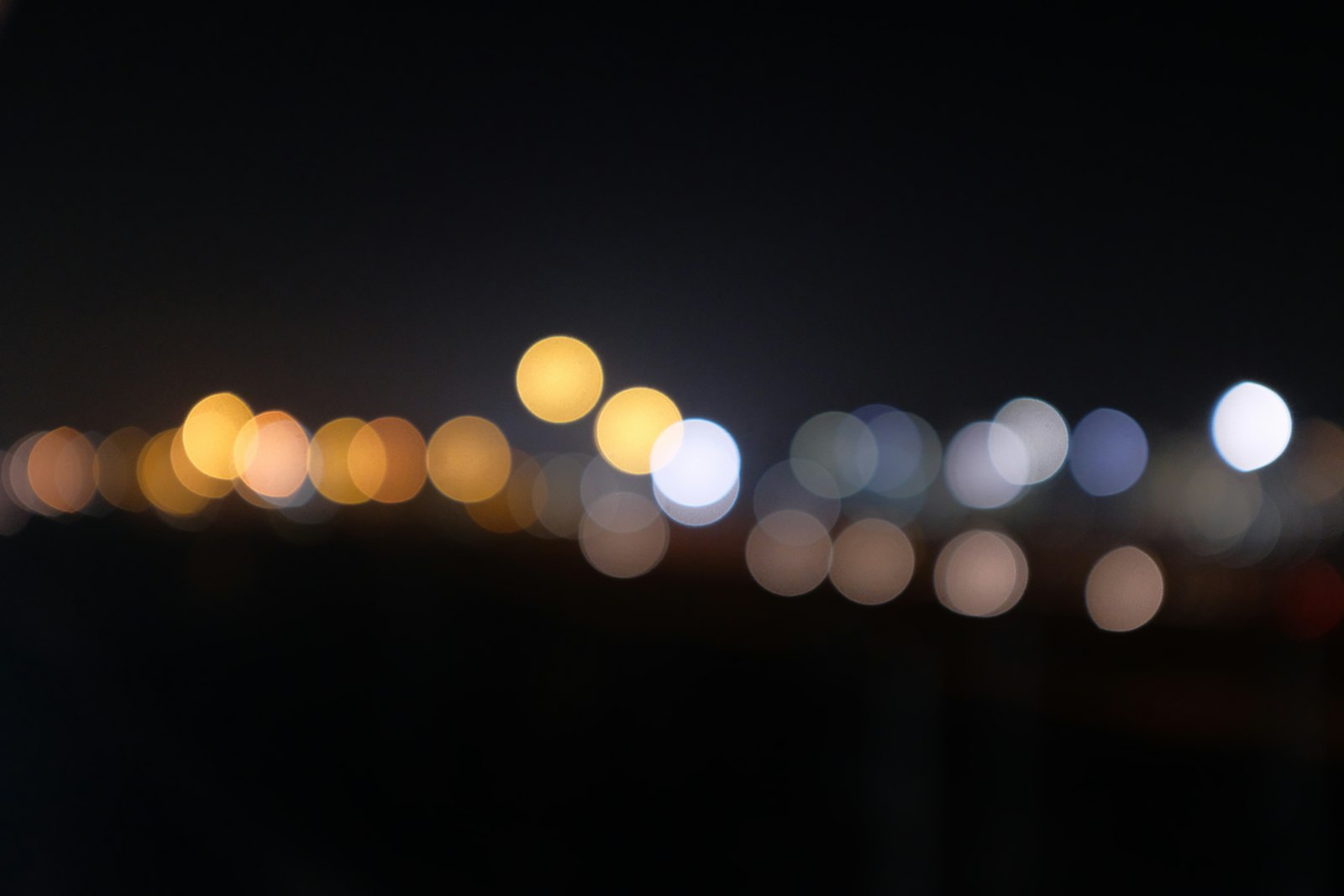 Dark night scene with city lights showing low-light ISO