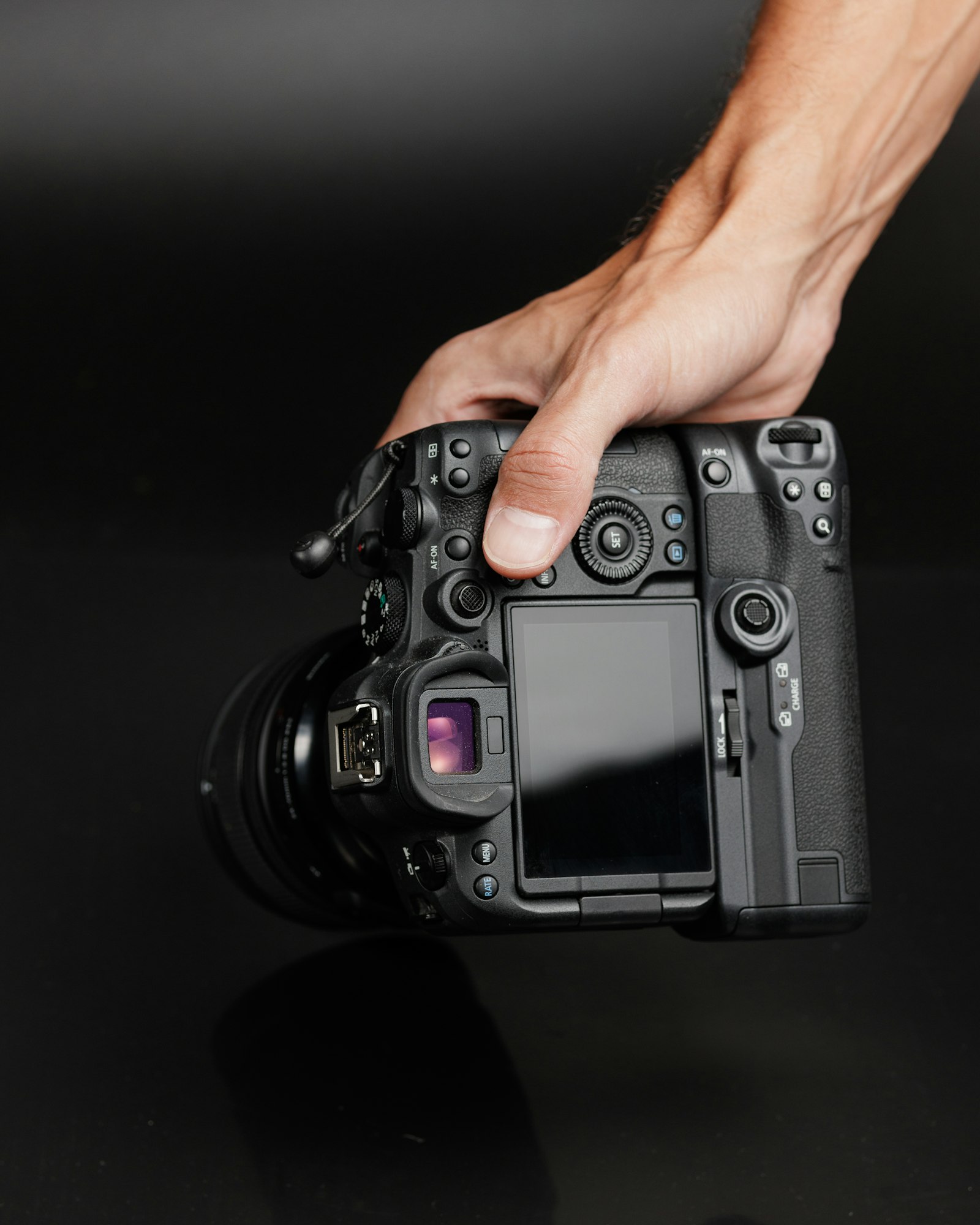 Hand holding a camera body