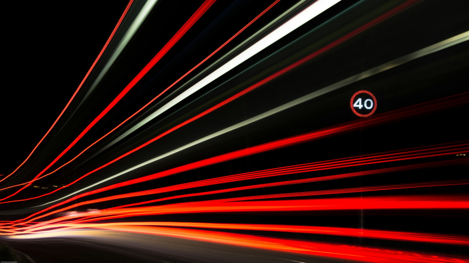 Long exposure light trails of red and white car lights at night